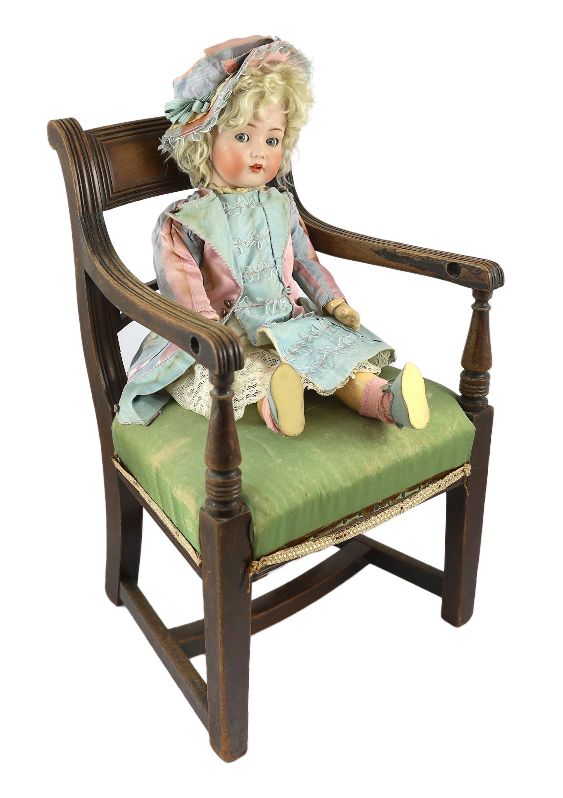 A Kammer & Reinhardt / Simon & Halbig bisque character doll, German, circa 1911, 21in. Please note the chair is for display purposes only.